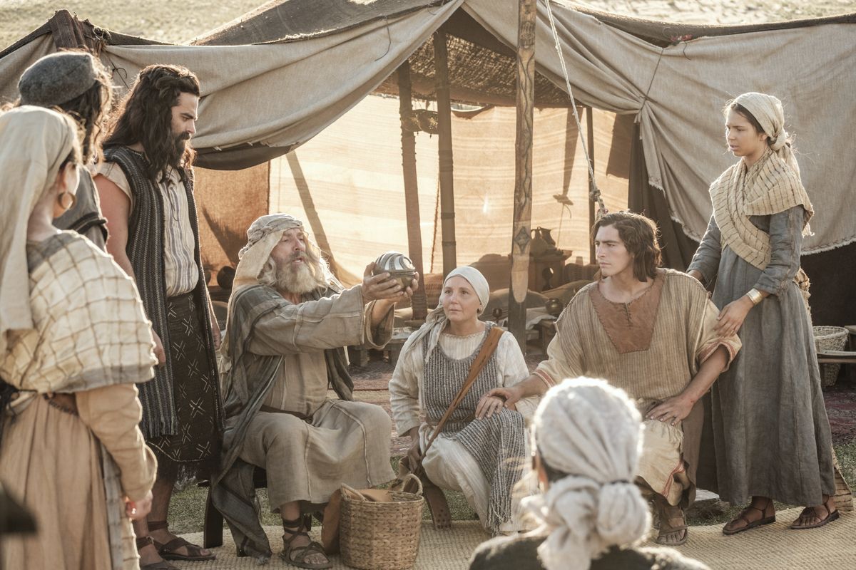 Lehi showing the Liahona to his family